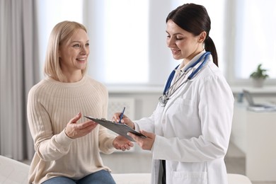 Photo of Woman having appointment with doctor in hospital