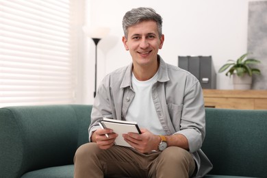 Photo of Portrait of professional psychologist with notebook in office