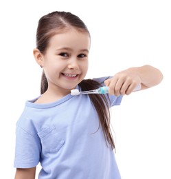 Photo of Cute girl with toothbrush on white background