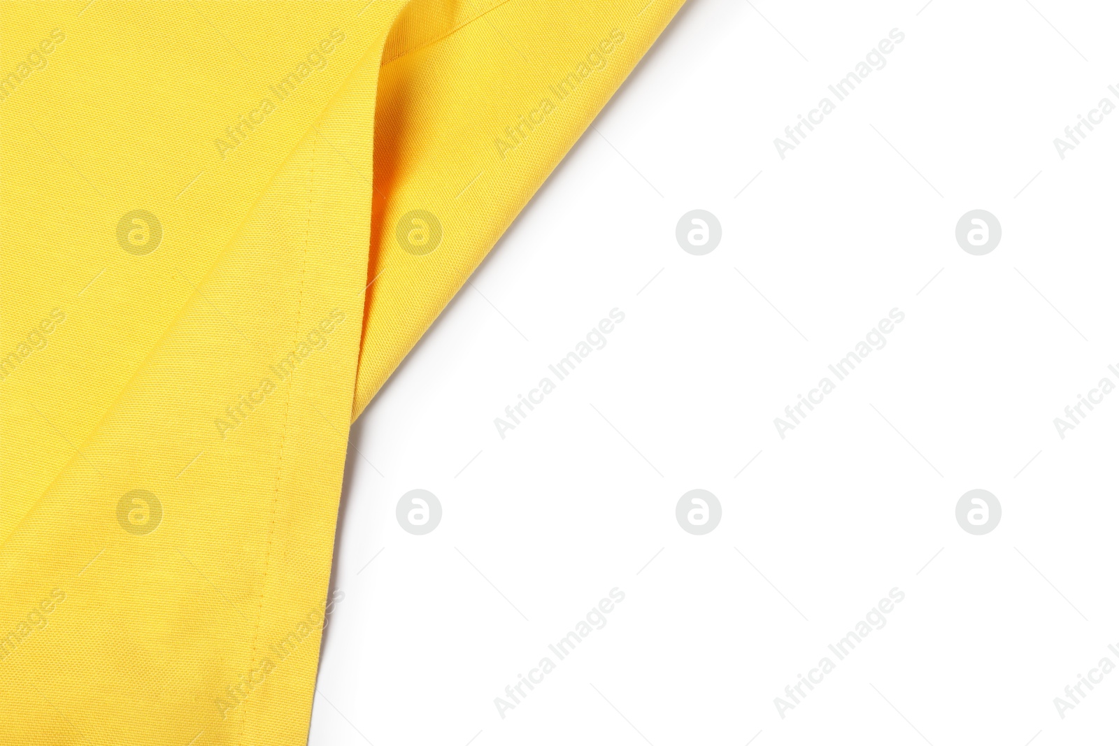 Photo of Yellow tablecloth isolated on white, top view