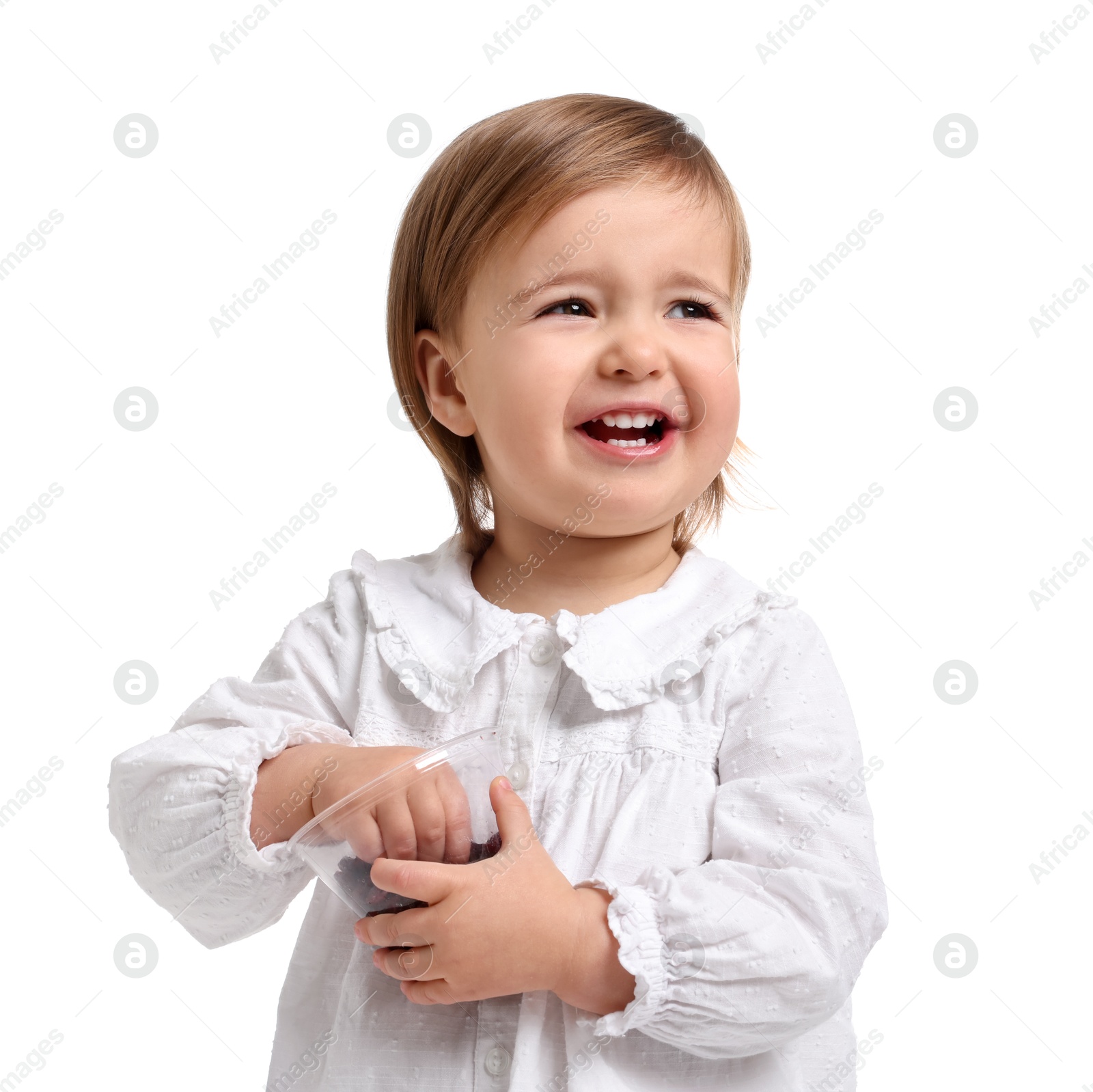 Photo of Cute little baby girl eating snack on white background