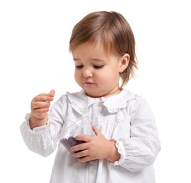 Photo of Cute little baby girl eating snack on white background