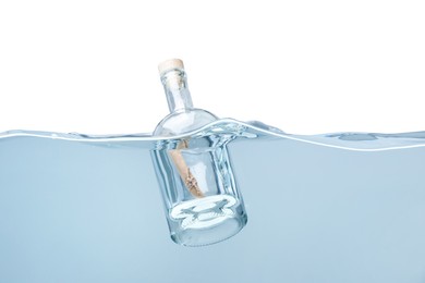 Photo of Corked glass bottle with rolled letter in water on white background