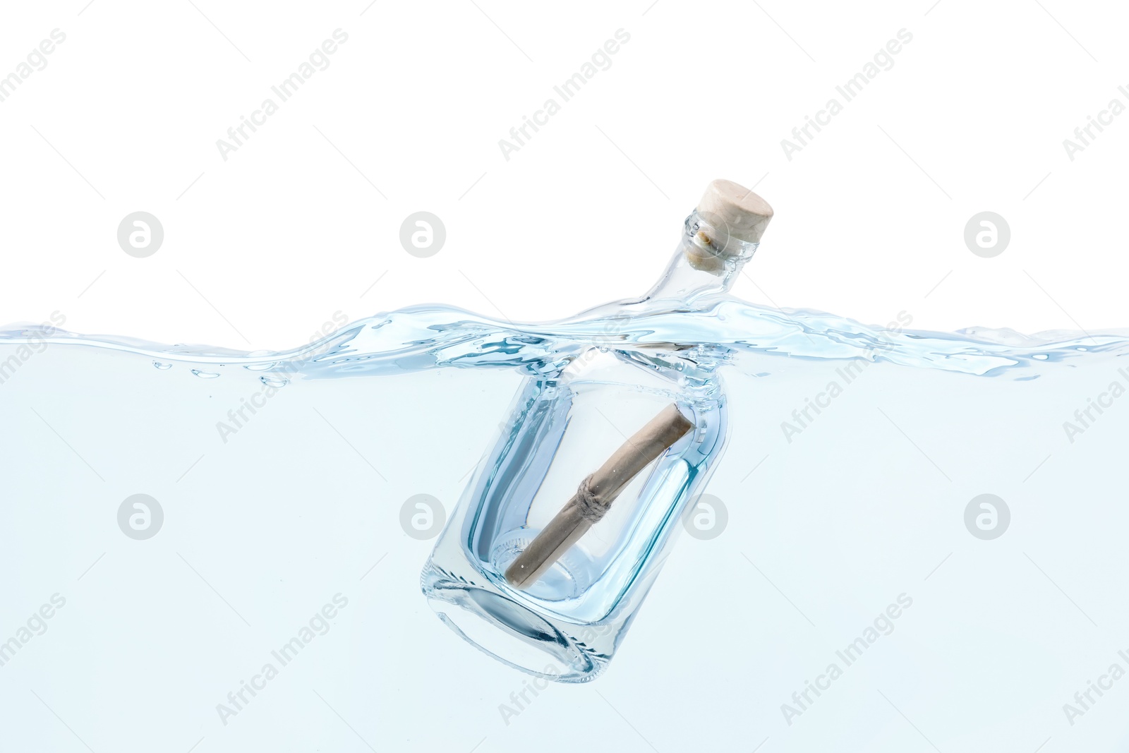 Photo of Corked glass bottle with rolled letter in water on white background