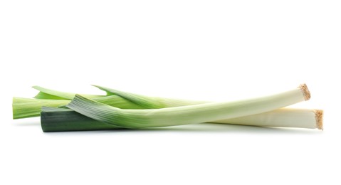 Photo of Fresh leeks isolated on white. Spicy vegetable