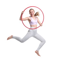 Photo of Beautiful young woman jumping with hula hoop on white background