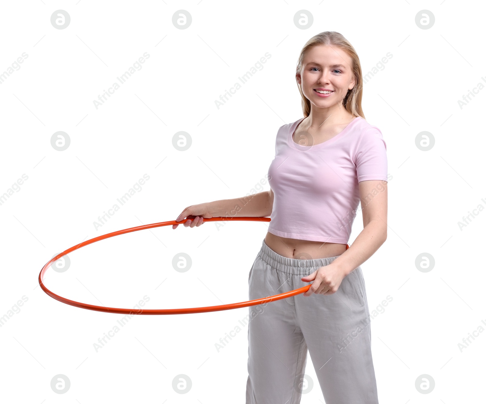 Photo of Beautiful young woman exercising with hula hoop on white background