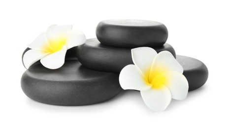 Photo of Spa stones with flowers isolated on white