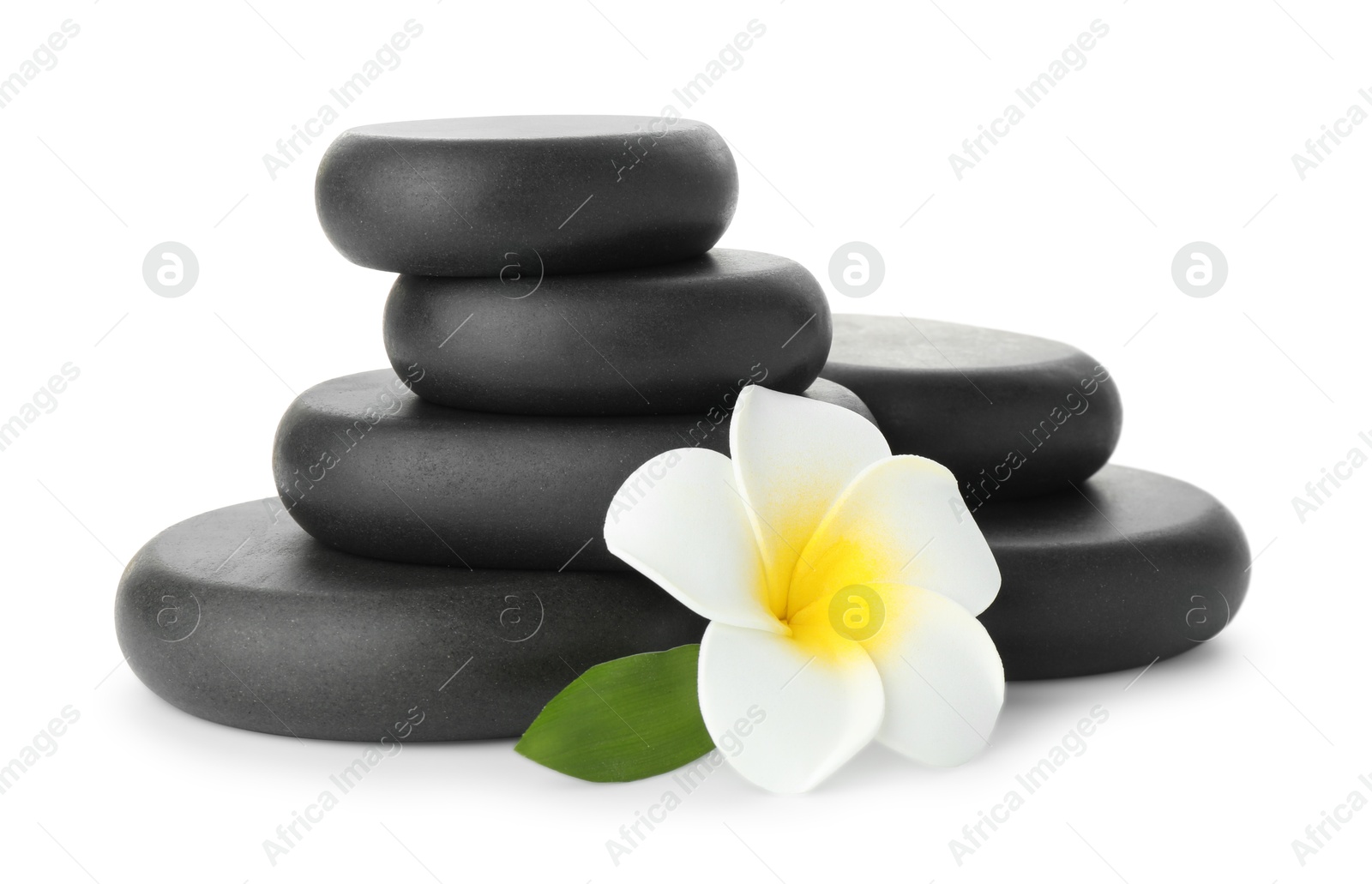 Photo of Spa stones with flower and leaf isolated on white