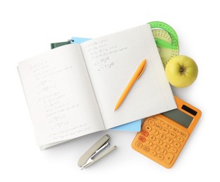 Photo of Doing homework. Notebook with math assignment, apple and stationery on white background, top view