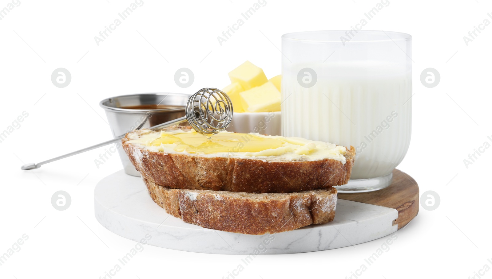 Photo of Slices of bread with butter, honey and milk isolated on white