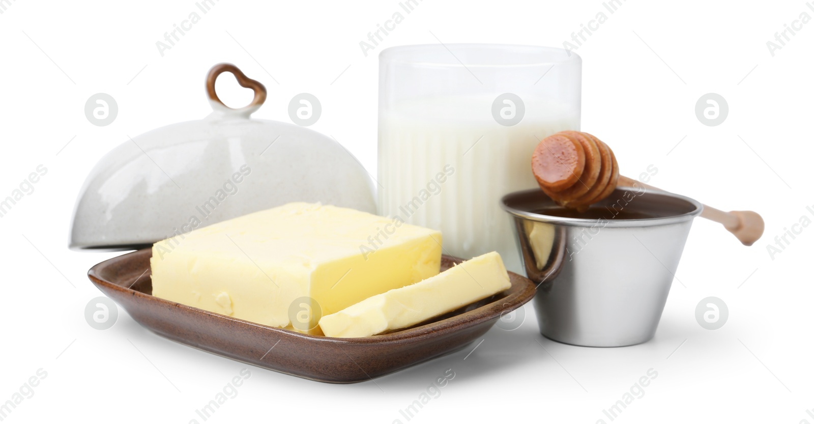 Photo of Fresh milk in glass, honey and butter isolated on white