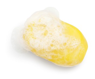 Photo of Yellow soap with foam on white background, above view