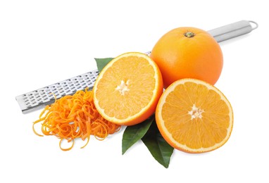 Photo of Pile of fresh orange zest, fruits, leaves and grater isolated on white