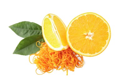 Photo of Pile of fresh orange zest, cut fruit and leaves isolated on white, top view