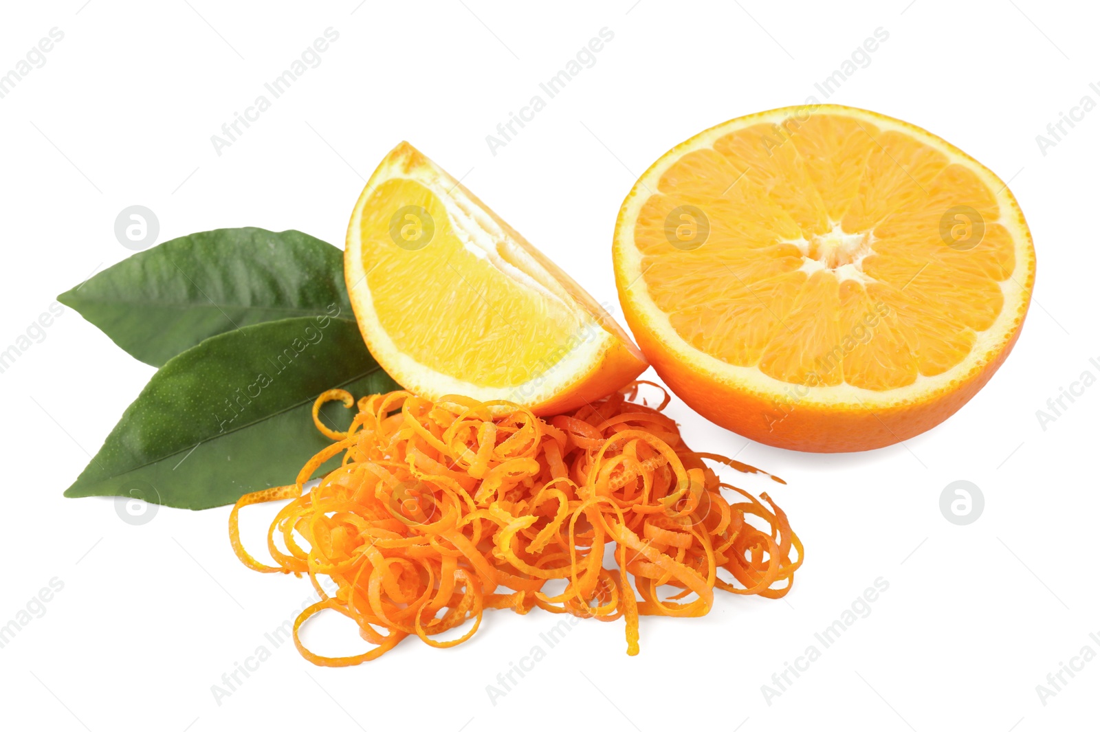 Photo of Pile of fresh orange zest, cut fruit and leaves isolated on white