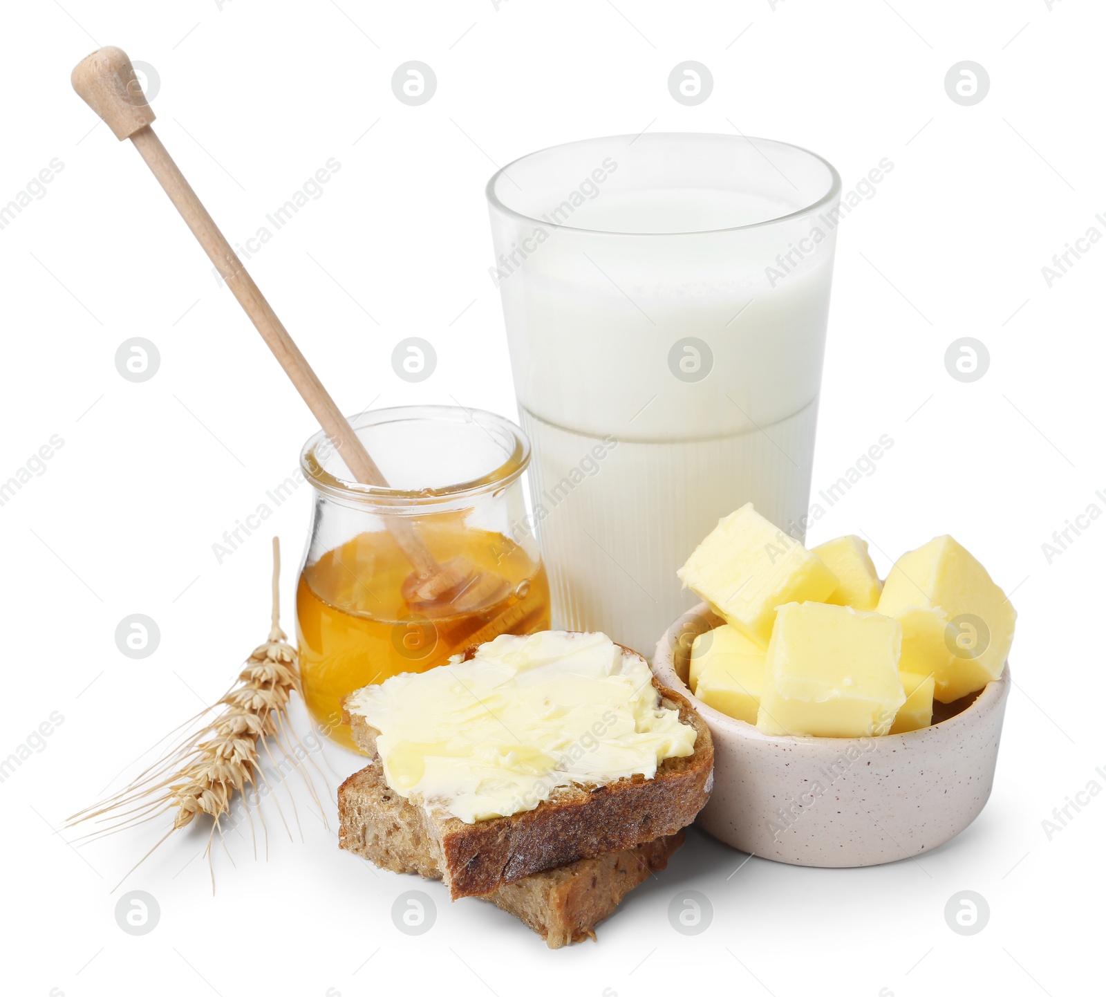 Photo of Tasty sandwich, butter, honey and milk isolated on white