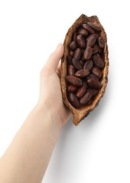 Photo of Woman holding cocoa pod with beans on white background, closeup