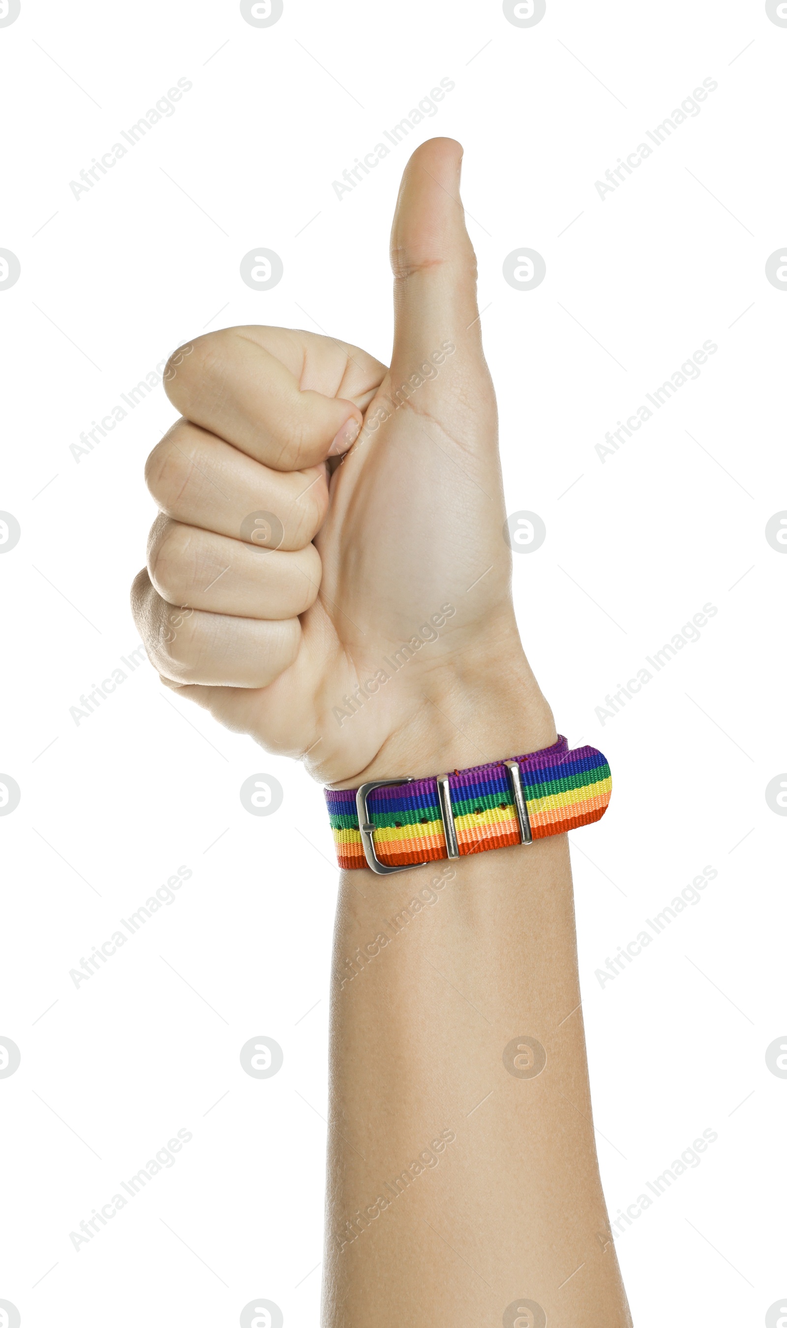 Photo of Man with bracelet in colors of LGBT flag showing thumbs up on white background, closeup