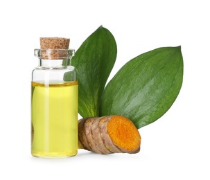 Photo of Bottle of turmeric essential oil, raw root and leaves isolated on white