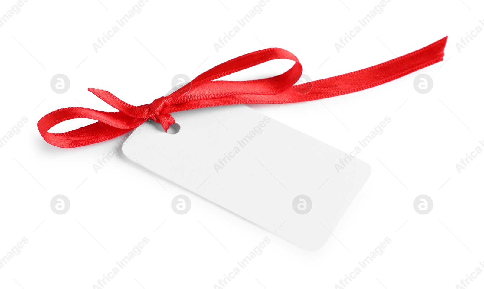 Photo of Blank tag with ribbon bow isolated on white