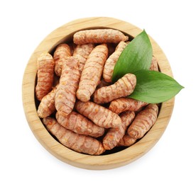 Photo of Tumeric rhizomes in bowl and leaves isolated on white, top view