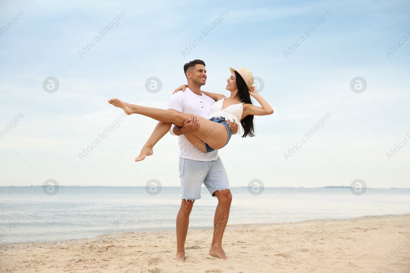 Photo of Lovely couple having fun on beautiful beach