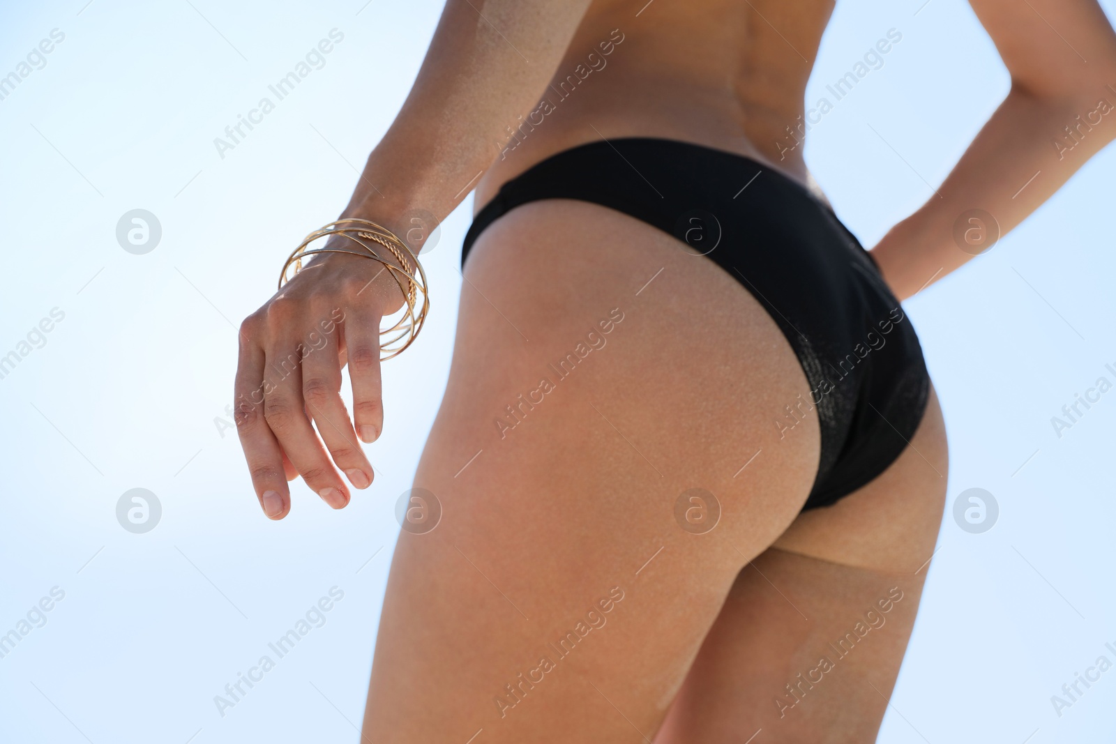 Photo of Young woman with beautiful body outdoors, closeup