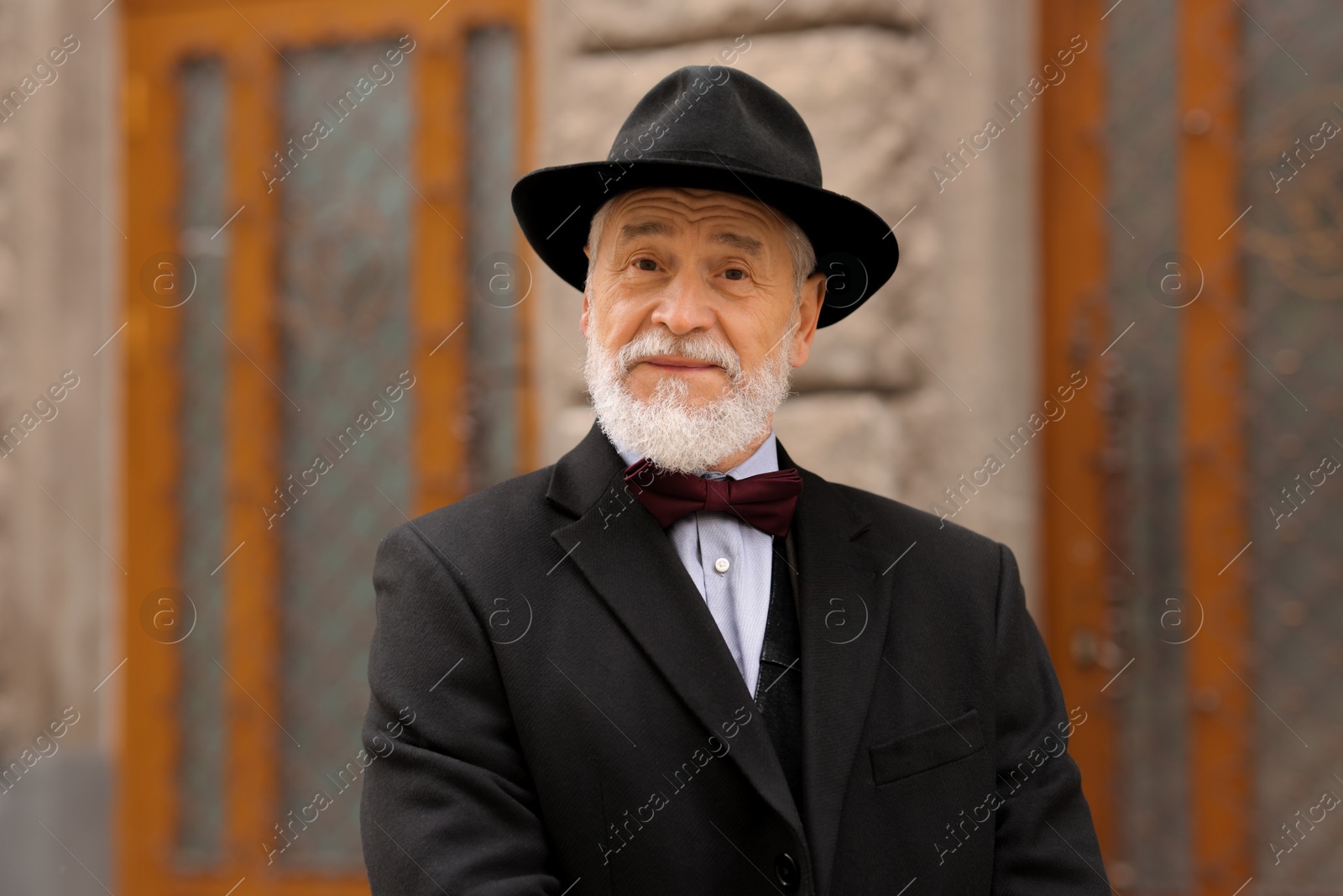 Photo of Bearded senior man in elegant outfit outdoors