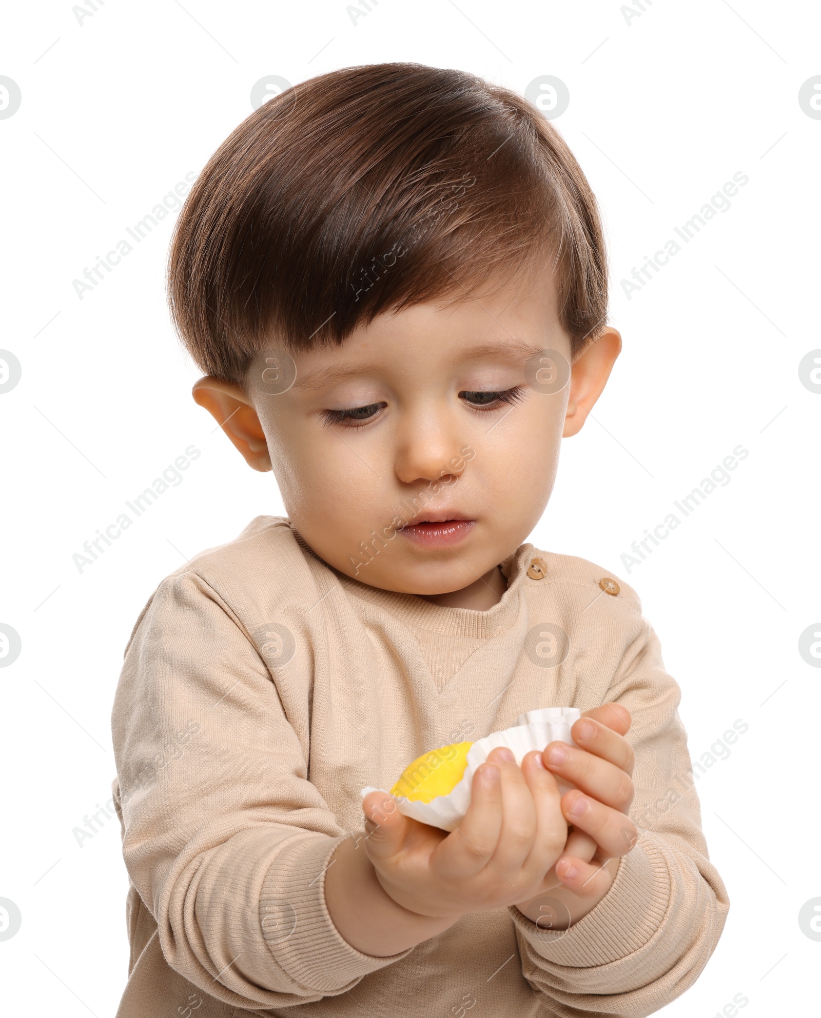 Photo of Cute little child with tasty mochi on white background