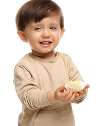 Photo of Cute little child with tasty mochi on white background