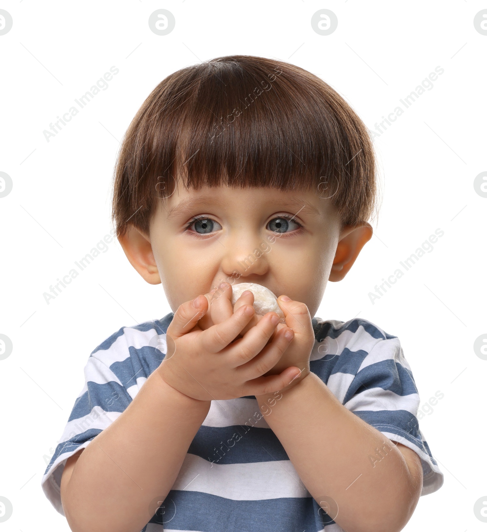 Photo of Cute little child eating tasty mochi on white background