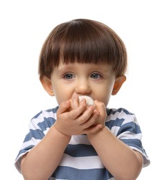 Photo of Cute little child eating tasty mochi on white background