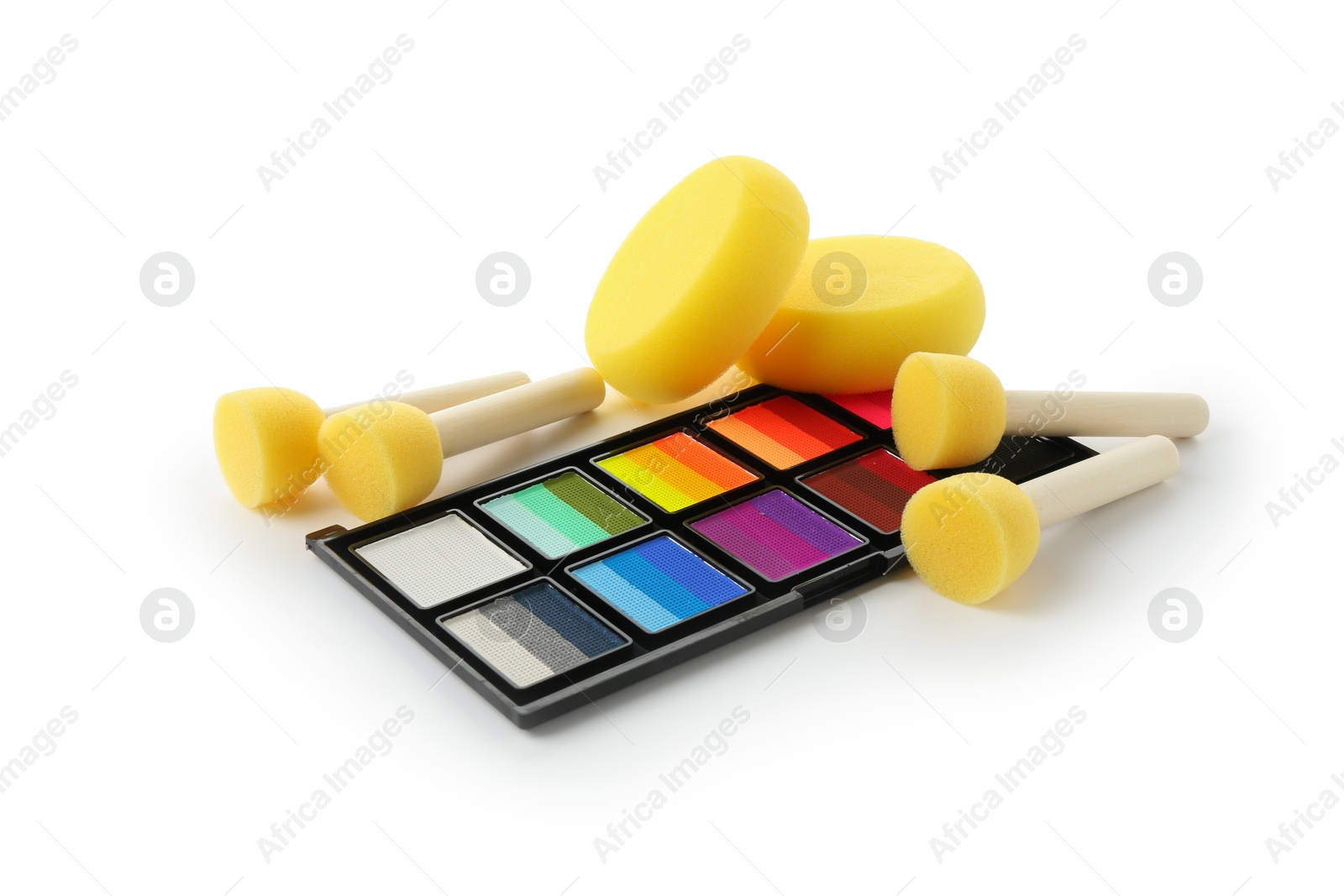 Photo of Bright face paint palette and sponges isolated on white