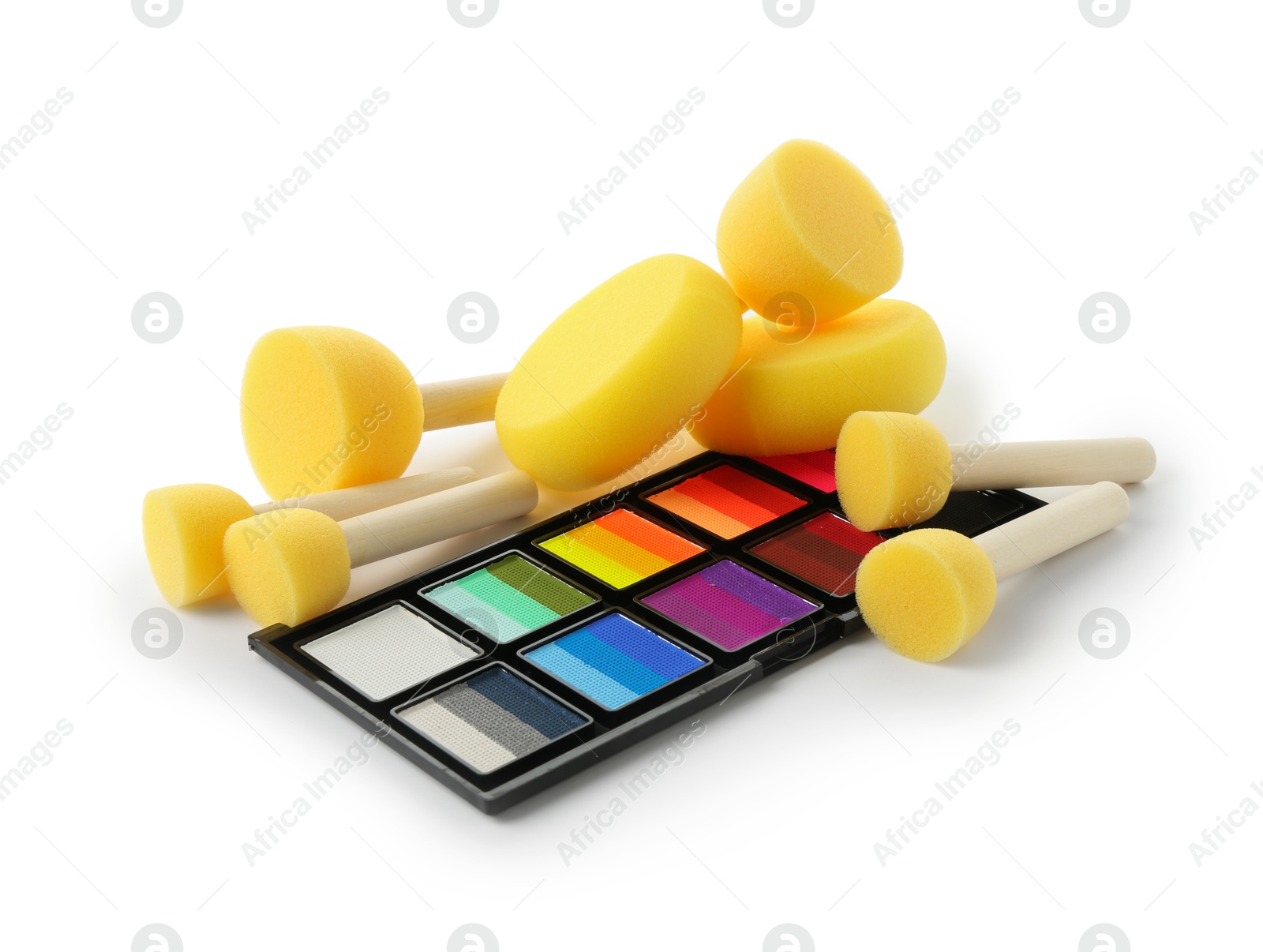 Photo of Bright face paint palette and sponges isolated on white