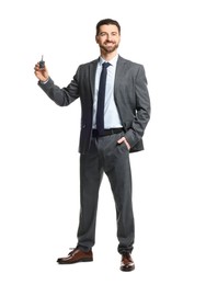 Photo of Cheerful salesman with car key on white background