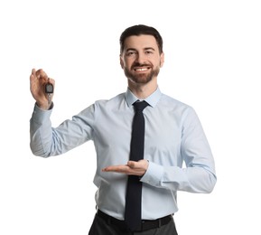 Photo of Cheerful salesman with car key on white background