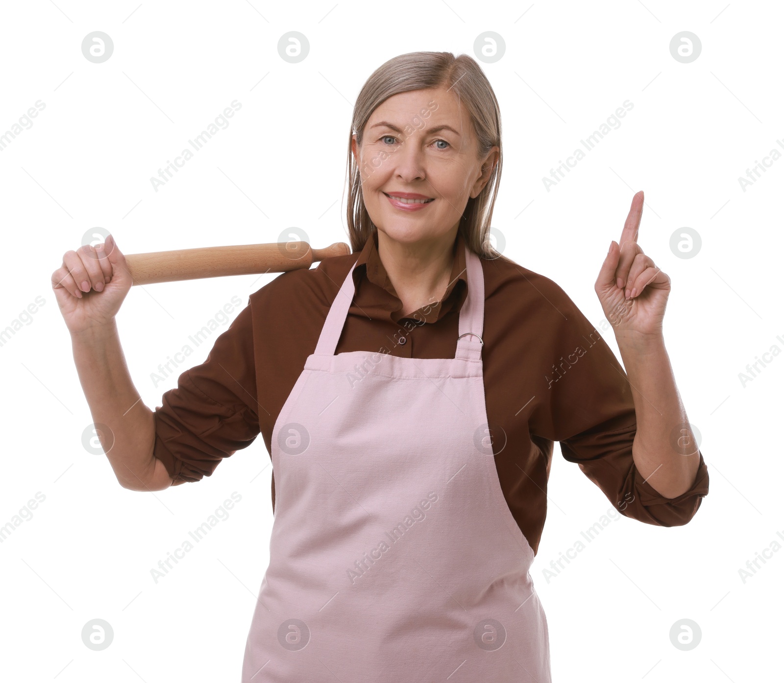 Photo of Happy woman with rolling pin pointing upwards on white background