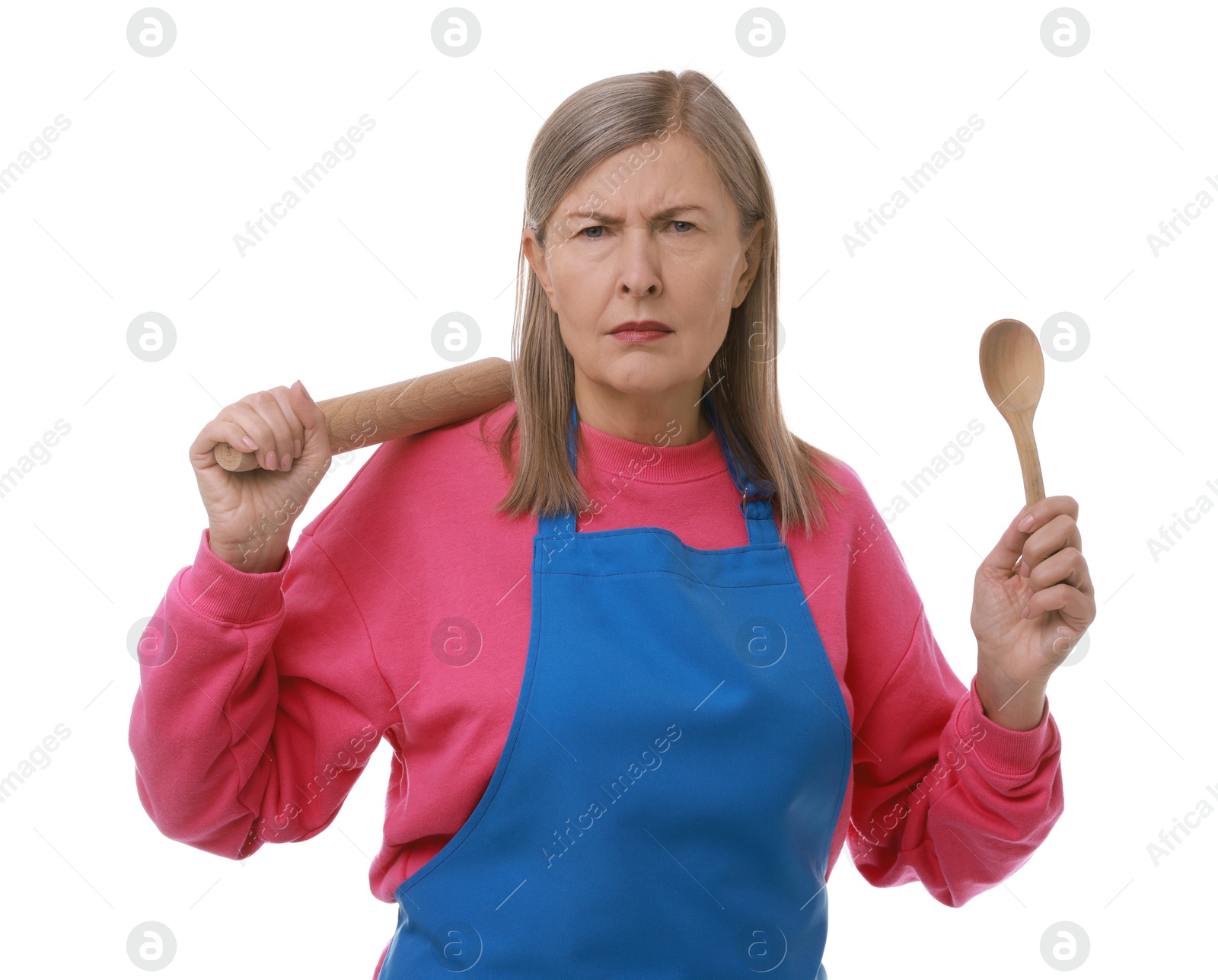 Photo of Angry woman with rolling pin and spoon on white background