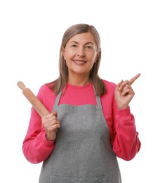 Photo of Happy woman with rolling pin pointing at something on white background