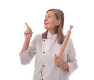 Photo of Happy chef with rolling pin pointing at something on white background