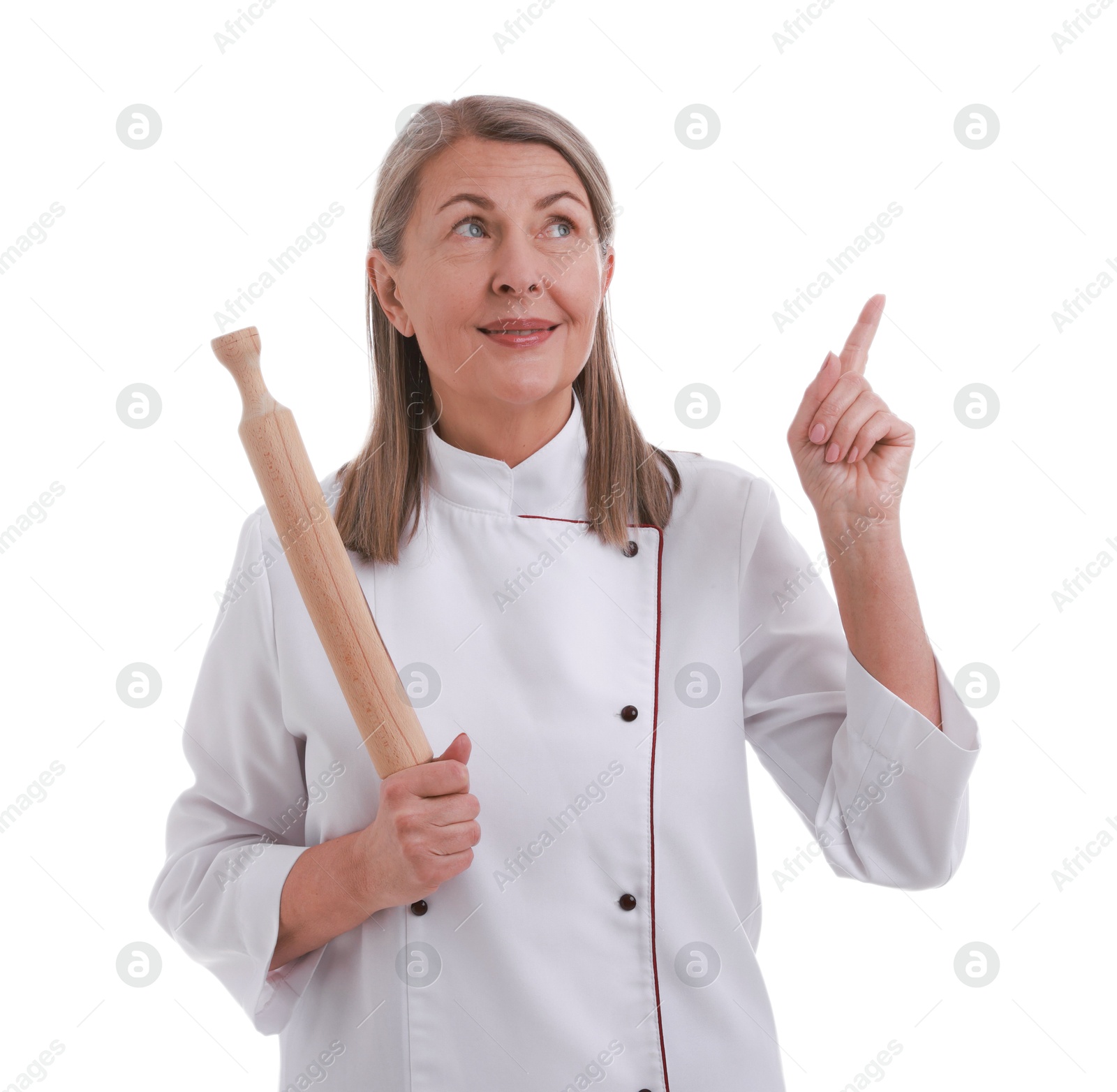 Photo of Happy chef with rolling pin pointing at something on white background