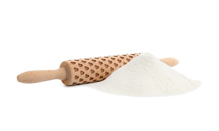 Photo of Patterned wooden rolling pin and pile of flour isolated on white