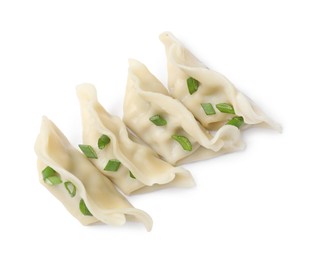 Photo of Fresh gyoza dumplings with pieces of green onion isolated on white, top view