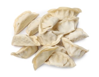 Photo of Fresh raw gyoza dumplings isolated on white, top view