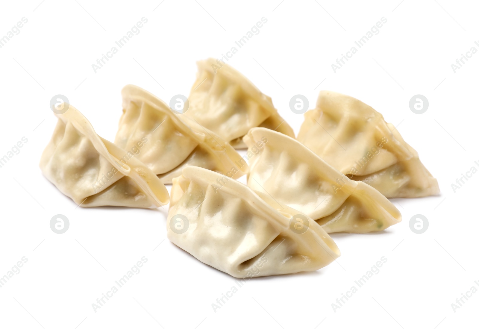 Photo of Many fresh gyoza dumplings isolated on white