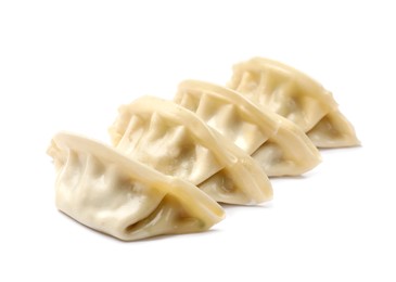 Photo of Fresh gyoza dumplings isolated on white. Chinese cuisine