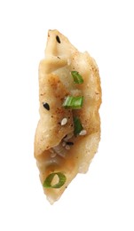 Photo of One fried gyoza dumpling with green onion isolated on white