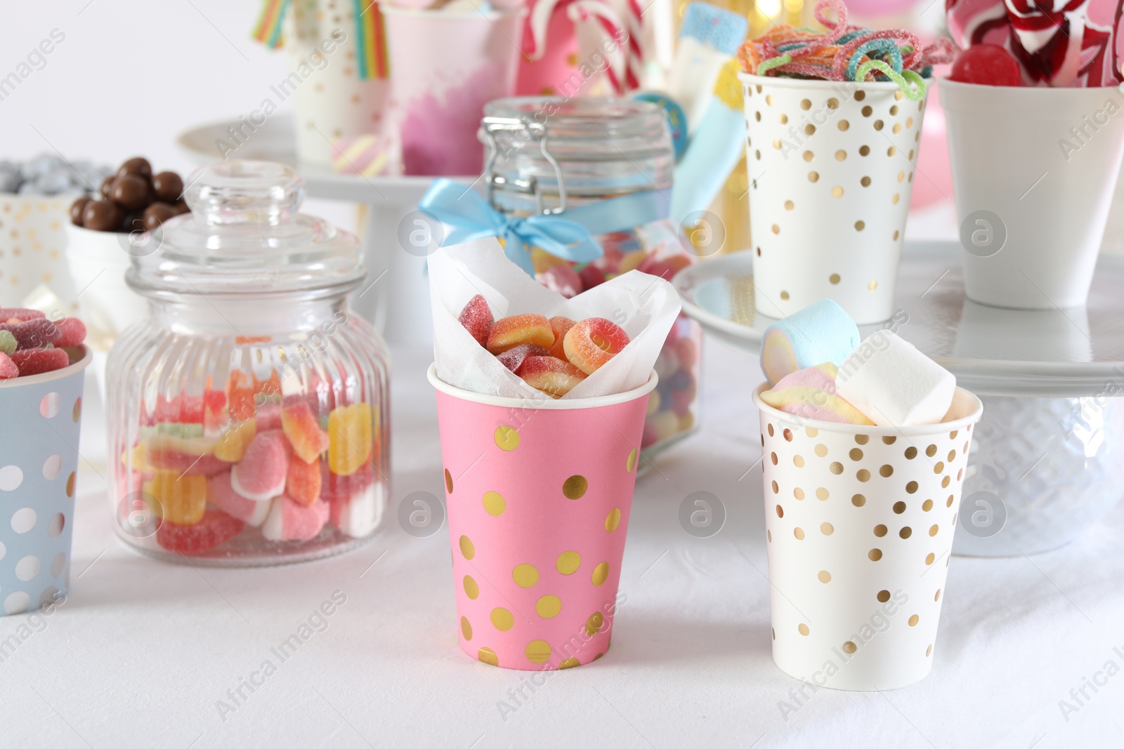 Photo of Candy bar. Many different sweets on white table