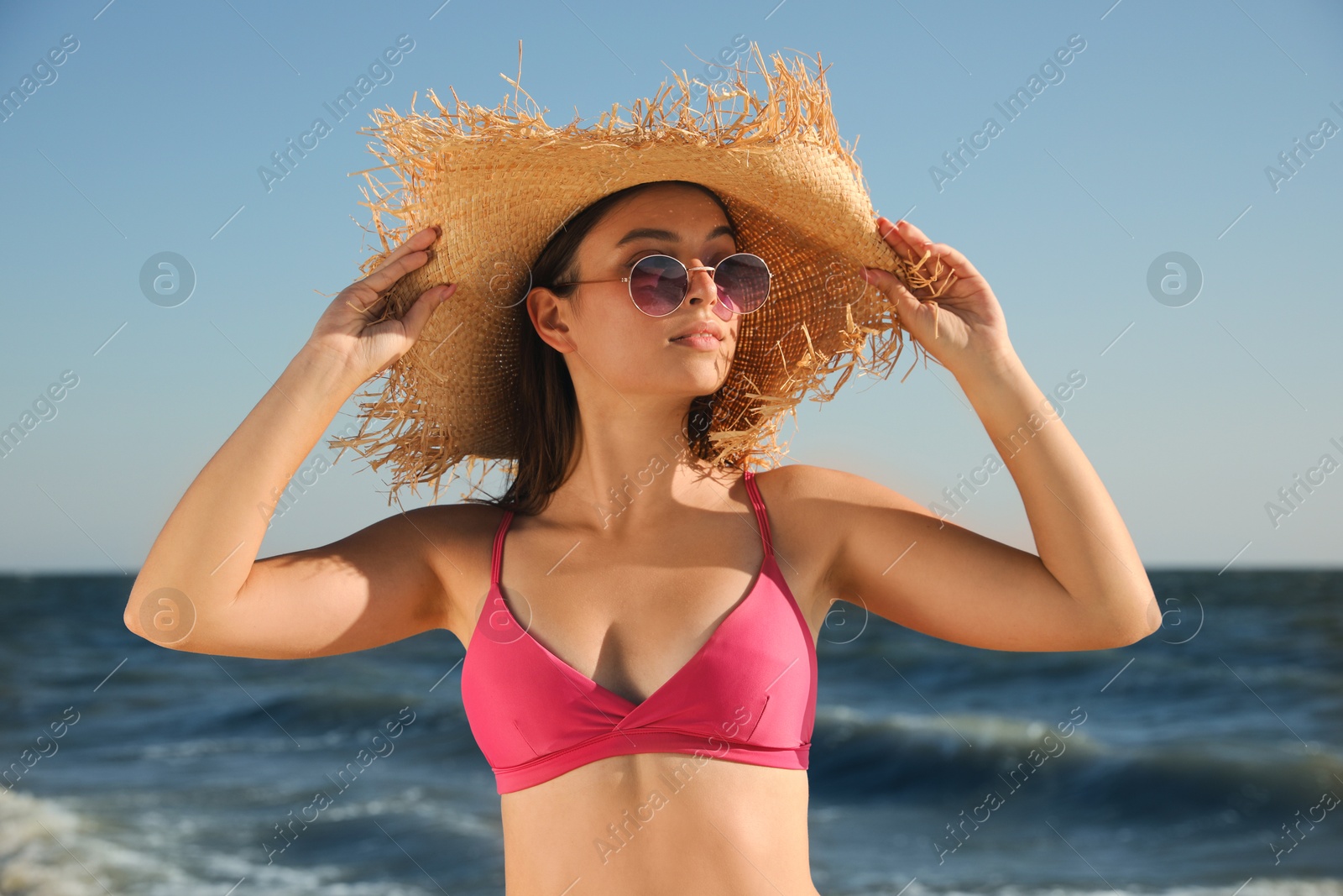 Photo of Beautiful young woman with attractive body on beach